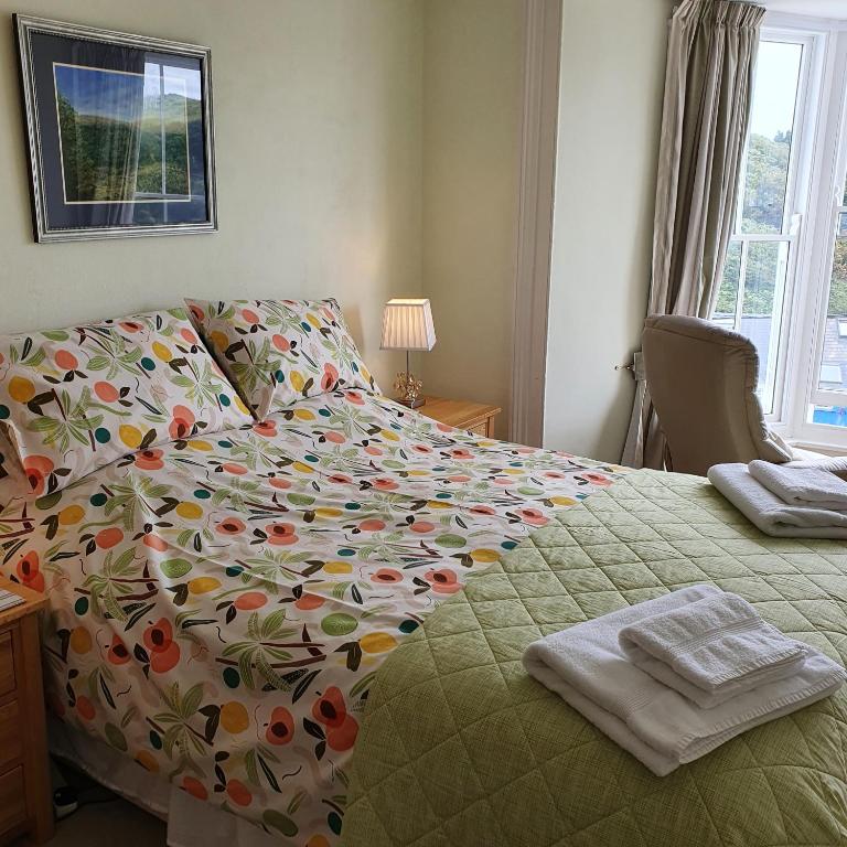 Deluxe Triple Room with Sea View | Pendyffryn Guesthouse and B&B gallery image 1