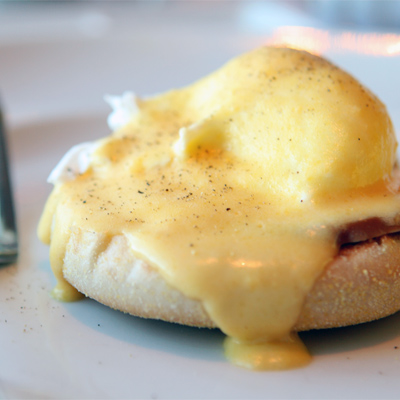 B&B in Little Haven and Wales eggs benedict close up of hollandaise sauce on poached egg and english muffin